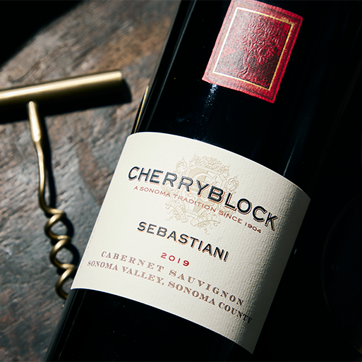 A close up image of Sebastiani Cherryblock bottle and a corkscrew