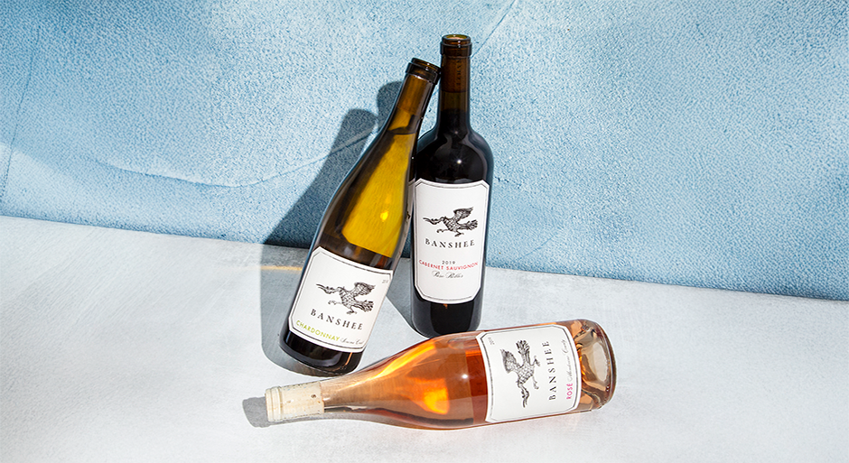 three bottles of banshee wines against a blue and white background