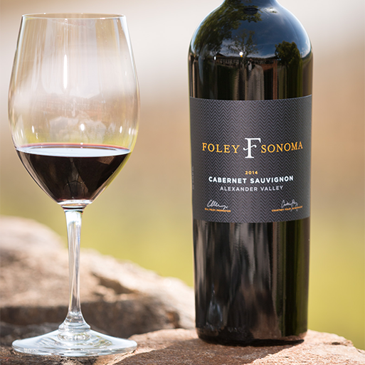 A bottle of Foley Sonoma Cabernet Sauvignon next to a poured glass of the wine